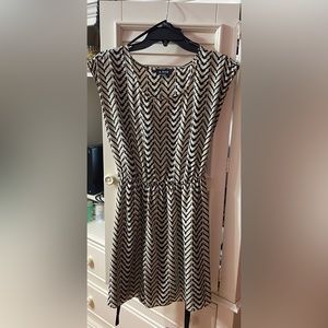 Tan and black mini dress with black waist belt